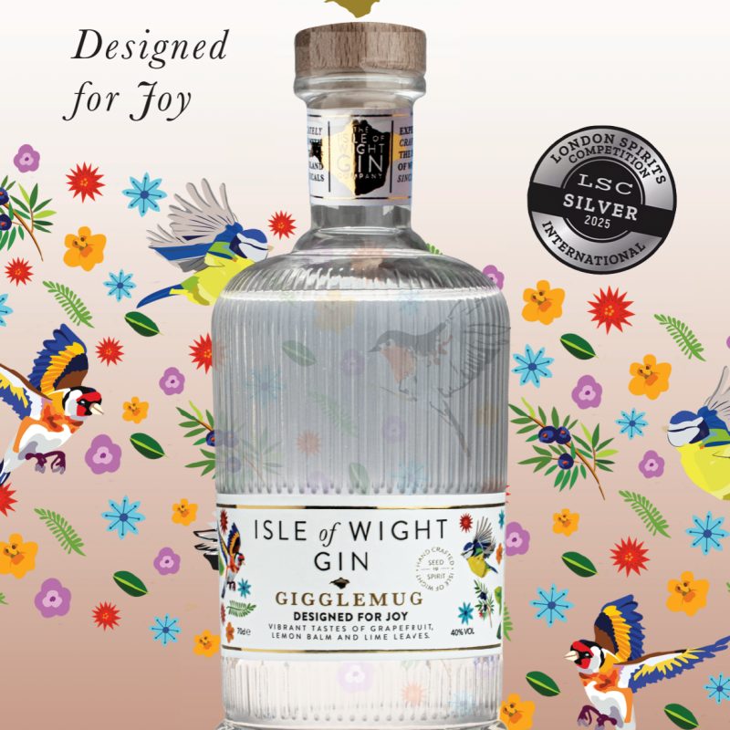 an Advert depicting a Gin bottle on a colourful background with the Isle of Wight Gin logo at the top.
