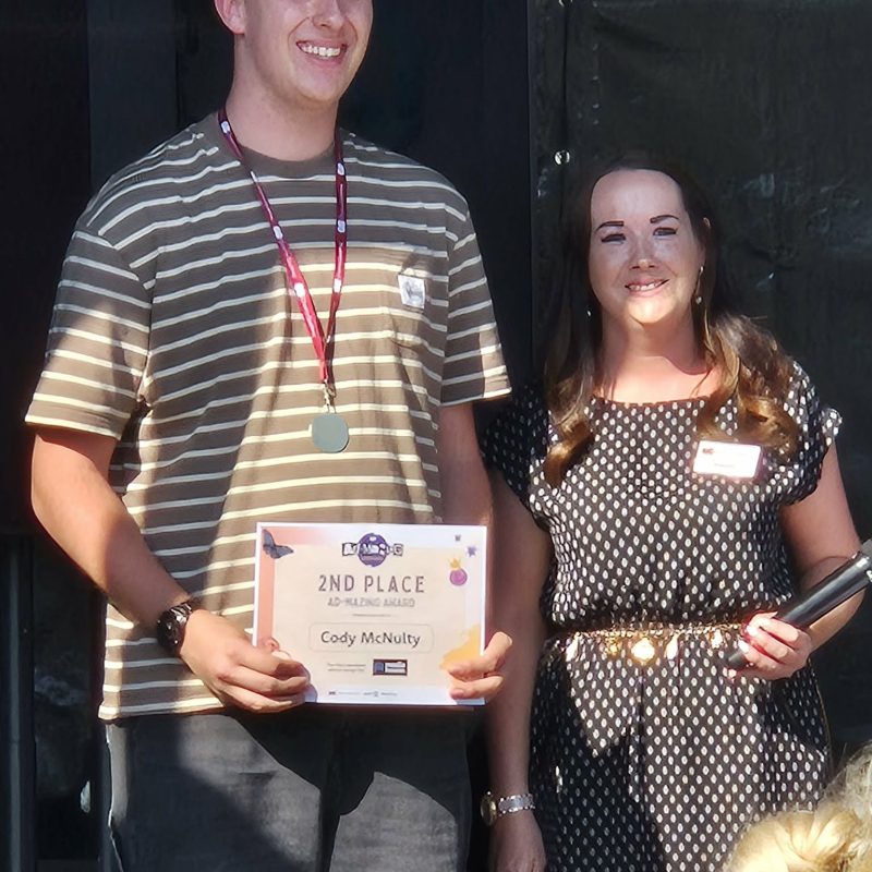 Winning Student holding his certificate