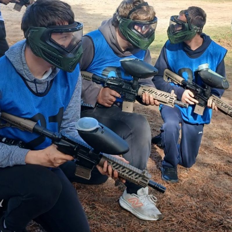 Students are geared up with paintball guns and paintball masks