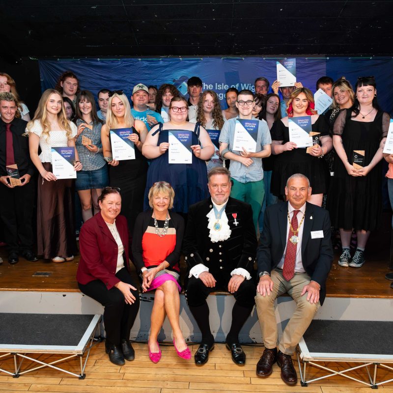 a large group photo of all of the students and their awards and certificates
