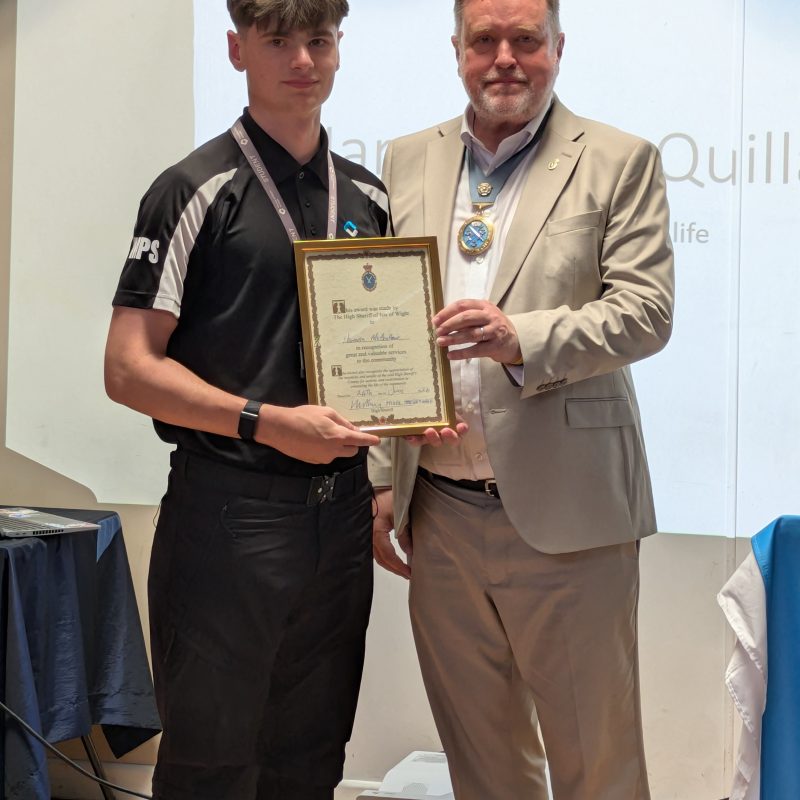 A student receives the High Sherriff award, pictured with the High Sherriff