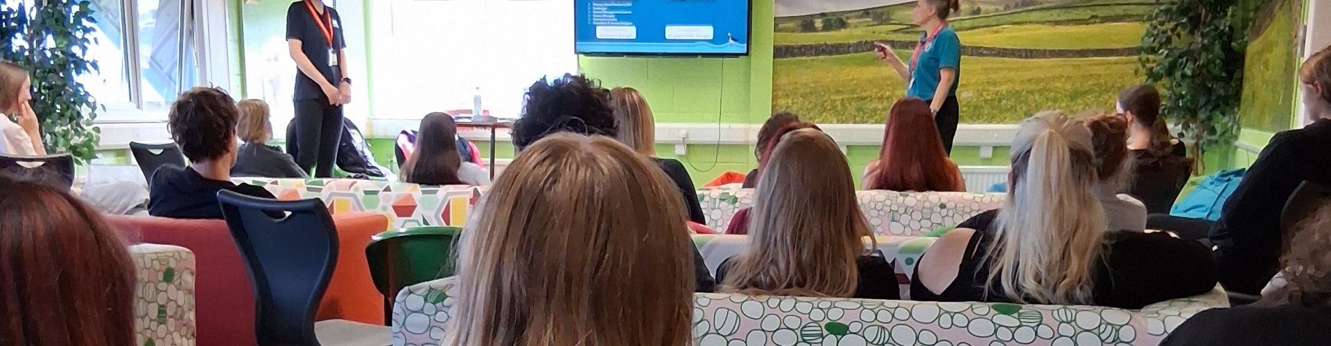 Students watch a presentation attentively.