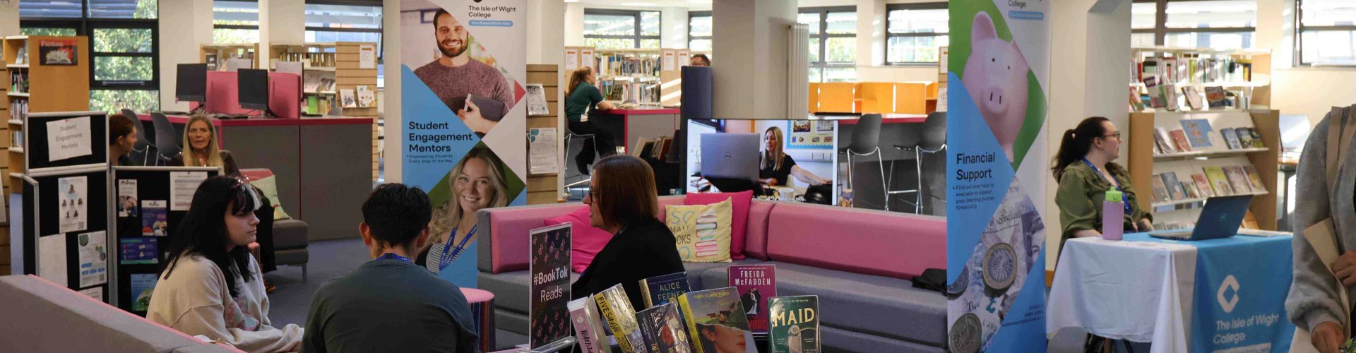 a Library set up with different pop-up banners and people throughout
